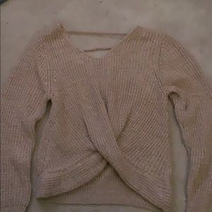 Twisted bottom sweater, partially open back